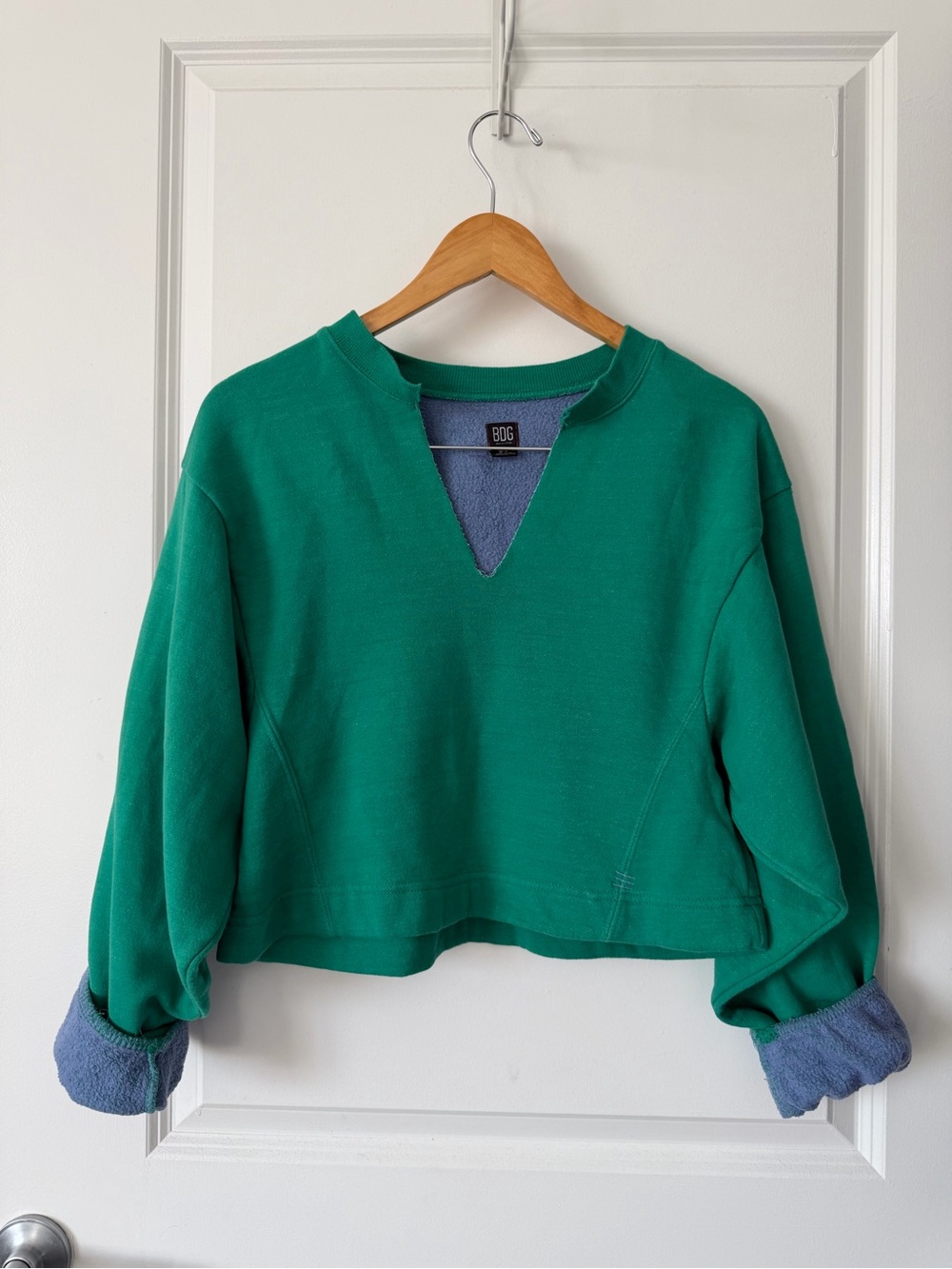 Green Sweatshirt with Blue V-Notch